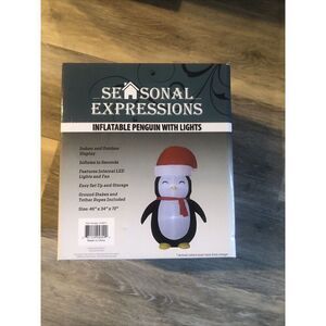 Seasonal expressions Airblown Inflatable Penguin with led lights. 46”x34”x72”